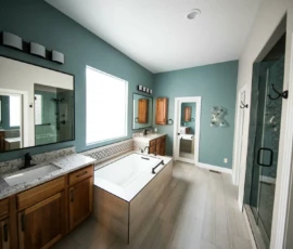 Bathroom Remodel - Image has green walls and a simple layout