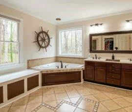 Bathroom Remodel - Image has brown cabinets, light brown walls, and a simple layout